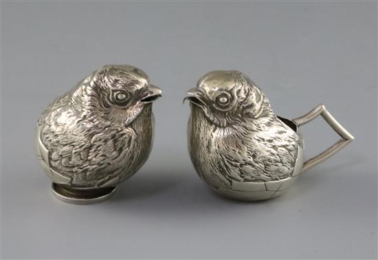 An Edwardian novelty silver cream jug and sugar sifter, each modelled as a hatching chick, by Sampson Mordan & Co, H.68mm.
